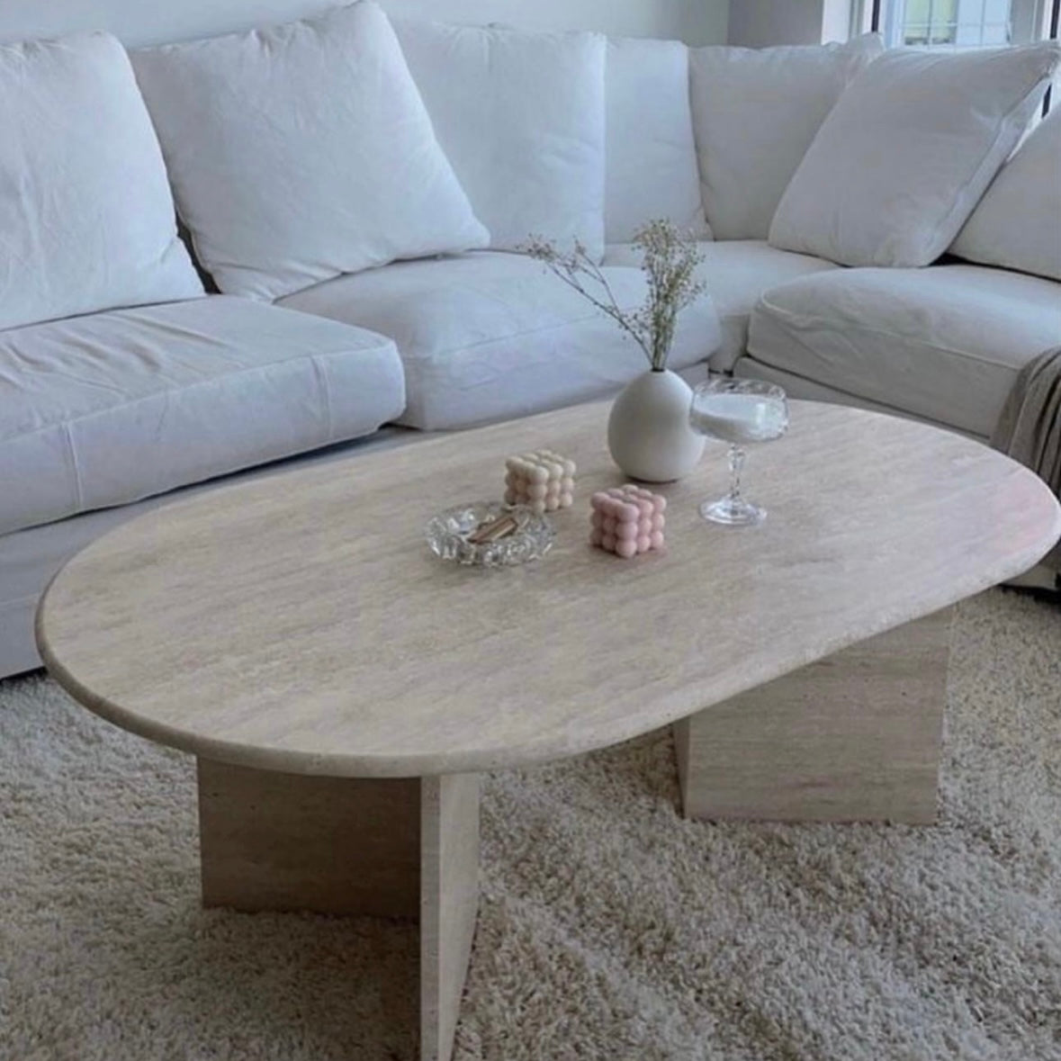 Table basse Ovale Travertin pied triangle